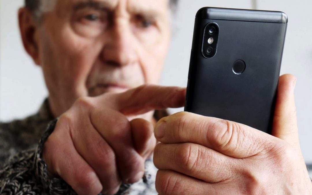 Older man looking at smart phone