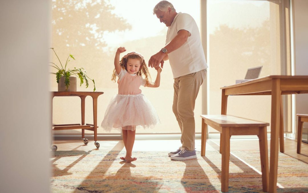 elderly man and child dancing